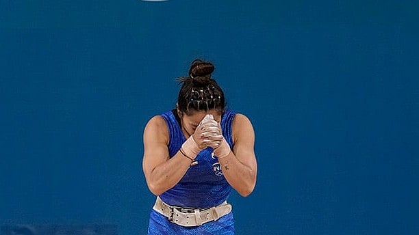 | Photo: PTI/Ravi Choudhary : Mirabai Chanu after her unsuccessful third attempt in weightlifting event 